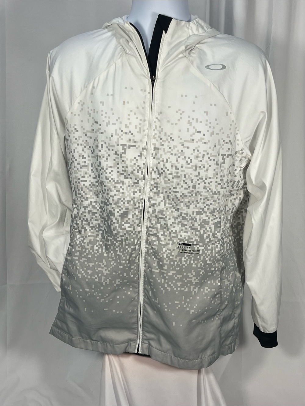 Oakley Gray & White Pixel Camo Performance Jacket. Hooded, pockets lightweight.